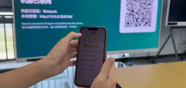 Riotouch display showing machine connected status, local management address and a pairing QR code